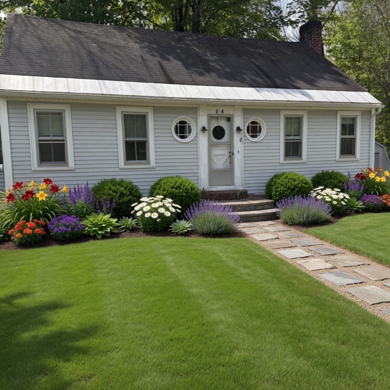 a front view of a house with garden