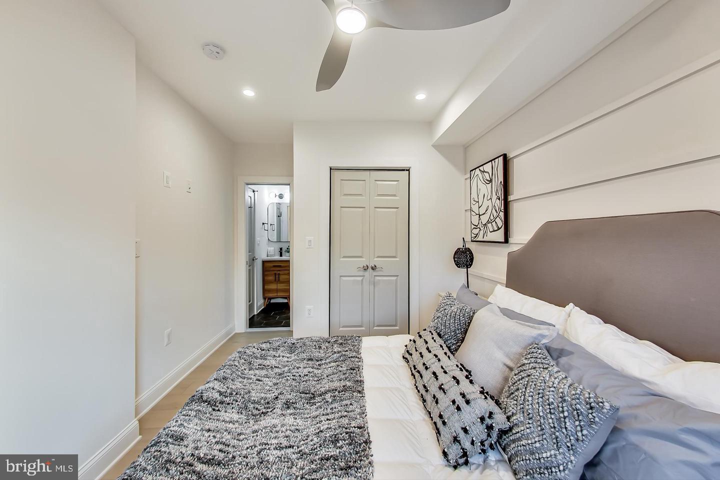 428 Evarts Street Northeast, Unit 2 Washington, DC 20017 - Photo 15 of 37 a bedroom with a bed and a walk in closet