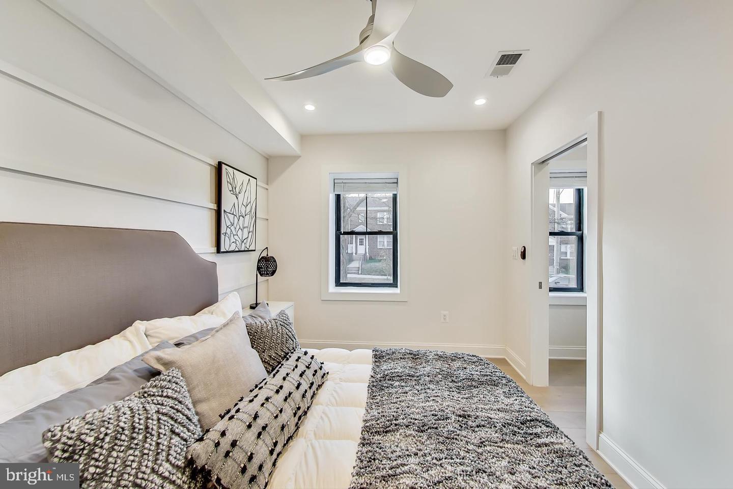 428 Evarts Street Northeast, Unit 2 Washington, DC 20017 - Photo 16 of 37 a bedroom with a bed and a window