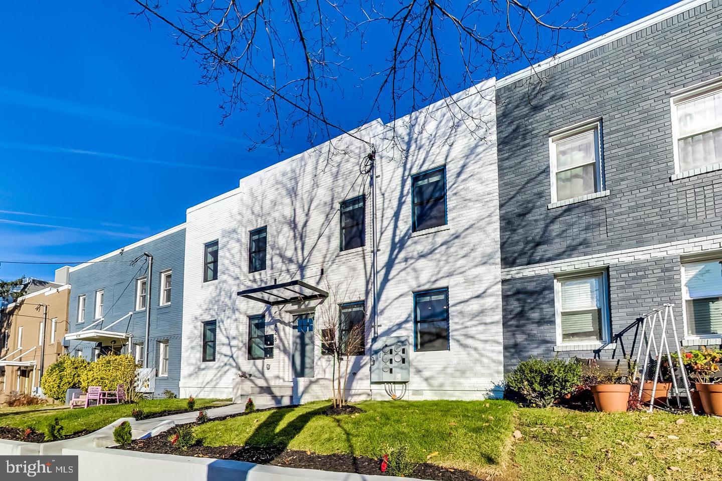 428 Evarts Street Northeast, Unit 2 Washington, DC 20017 - Photo 2 of 37 a view of a house with a yard