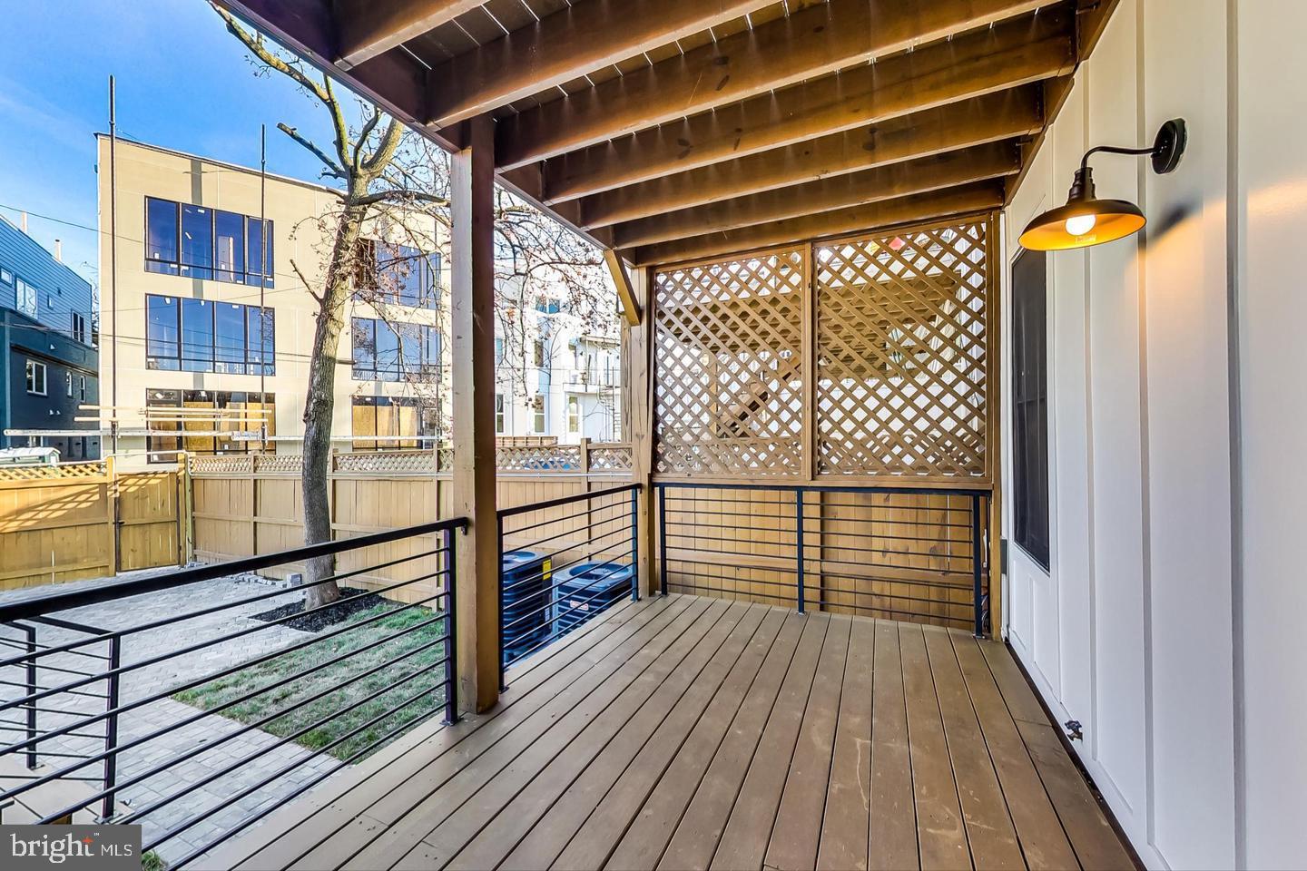 428 Evarts Street Northeast, Unit 2 Washington, DC 20017 - Photo 27 of 37 a view of a balcony with wooden floor