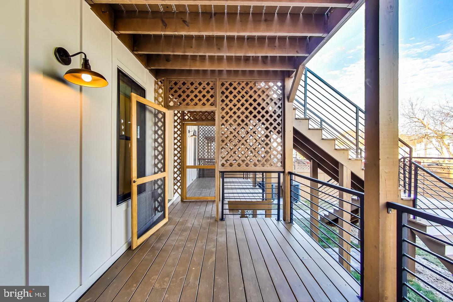 428 Evarts Street Northeast, Unit 2 Washington, DC 20017 - Photo 28 of 37 a view of entryway with wooden floor and stairs