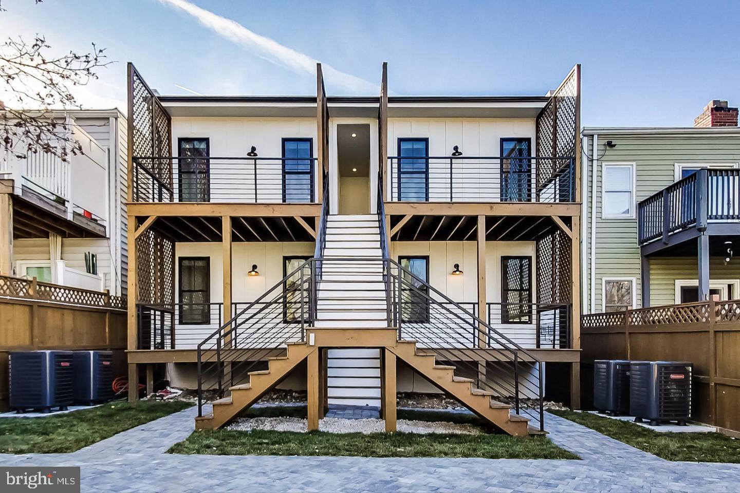 428 Evarts Street Northeast, Unit 2 Washington, DC 20017 - Photo 30 of 37 a front view of a house with a yard