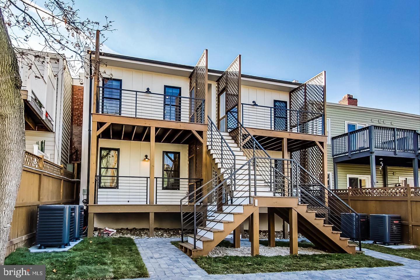 428 Evarts Street Northeast, Unit 2 Washington, DC 20017 - Photo 32 of 37 a front view of a house with a yard