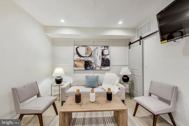 a kitchen with a table and chairs
