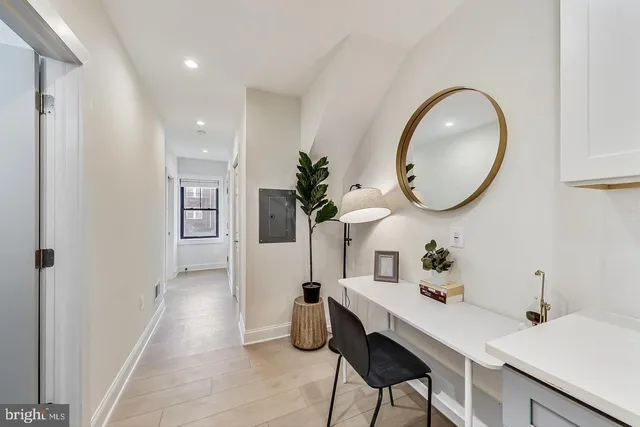 a kitchen with a table and chairs in it