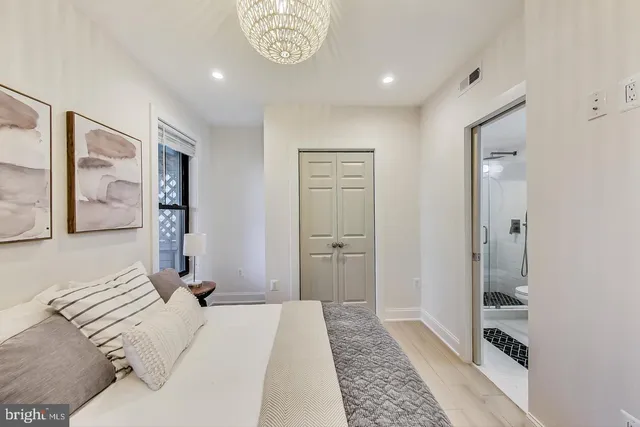 a bedroom with a bed and a walk in closet