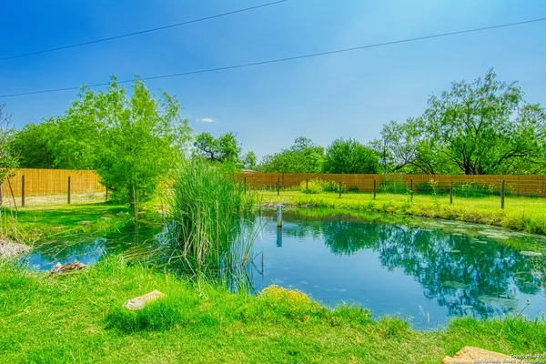 a view of a lake with a big yard