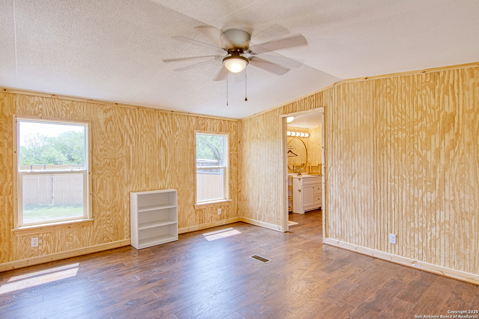 18883 La Gloria Road Elmendorf, TX 78112 - Photo 15 of 46 a view of an empty room with a window and bathroom