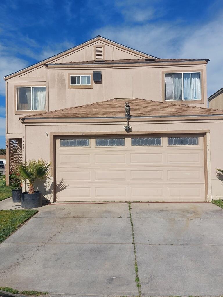 a view of a house with garage