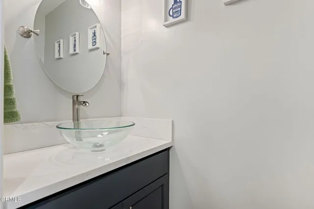 a room with a sink and a mirror