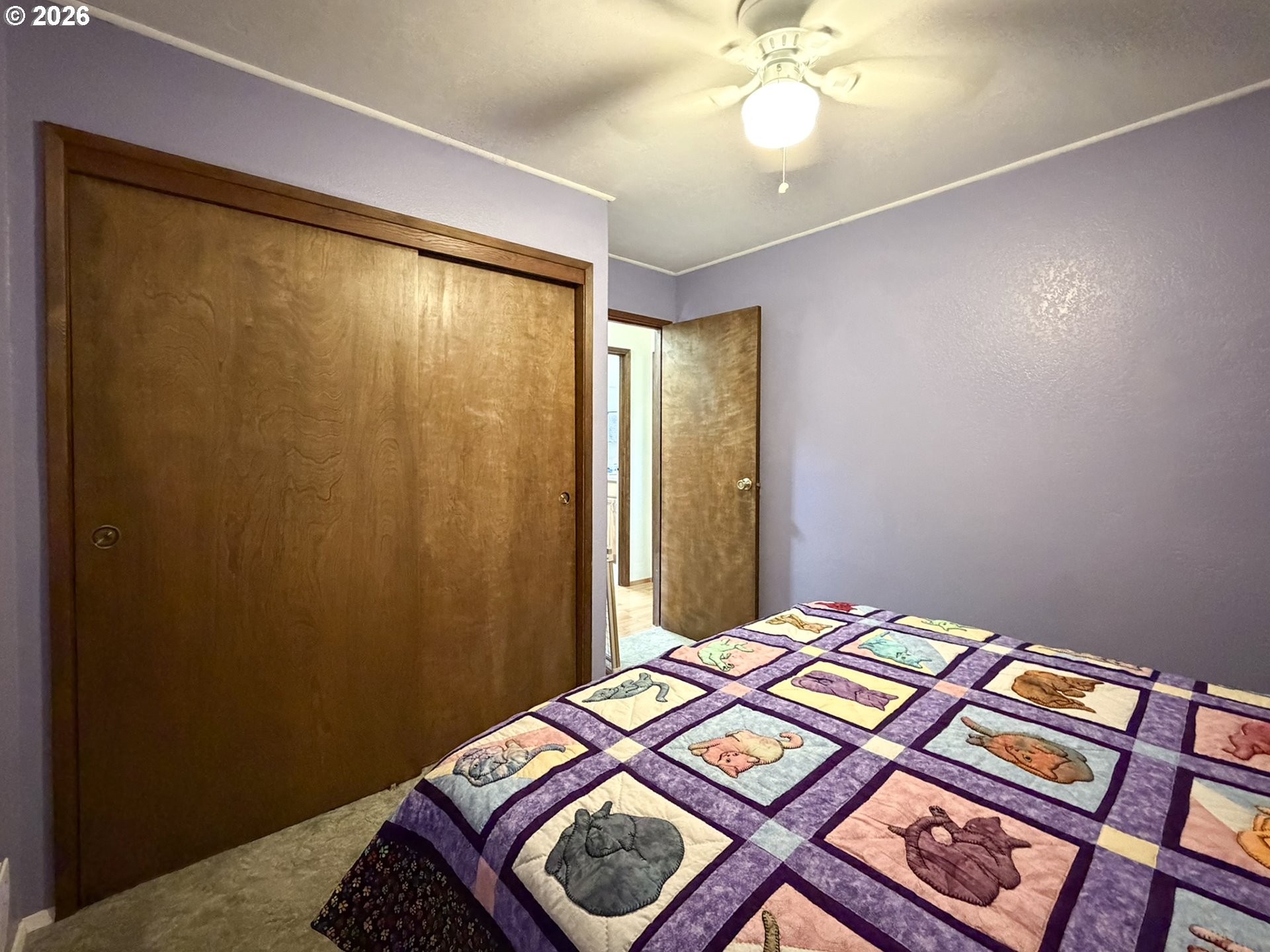 1372 Hampton Road Brookings, OR 97415 - Photo 18 of 42 a bedroom with a bed and a mirror