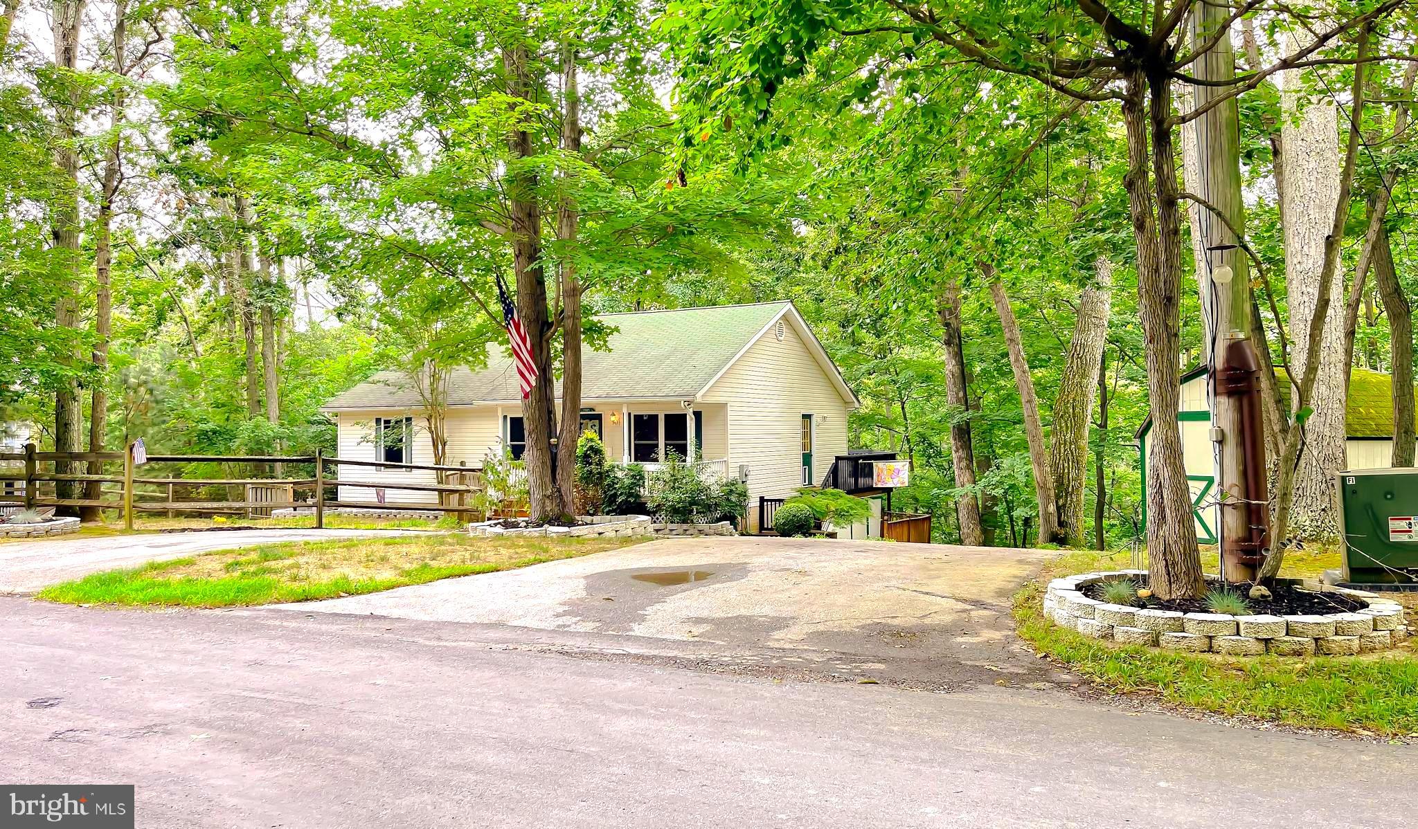 11517 Wrangler Road Lusby, MD 20657 - Photo 2 of 52 a view of a house with swimming pool and sitting area