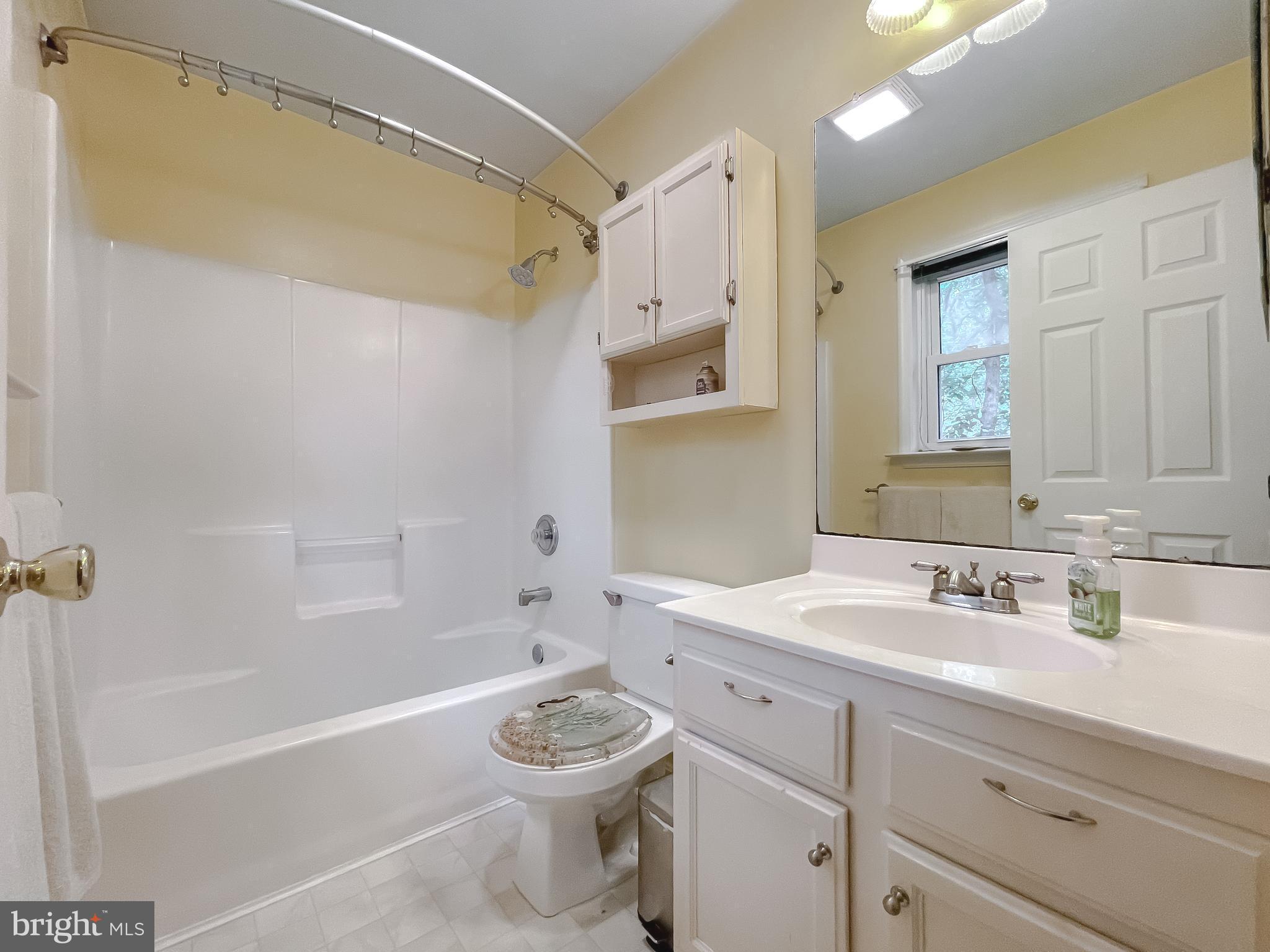 11517 Wrangler Road Lusby, MD 20657 - Photo 27 of 52 a bathroom with a sink a toilet and a bathtub