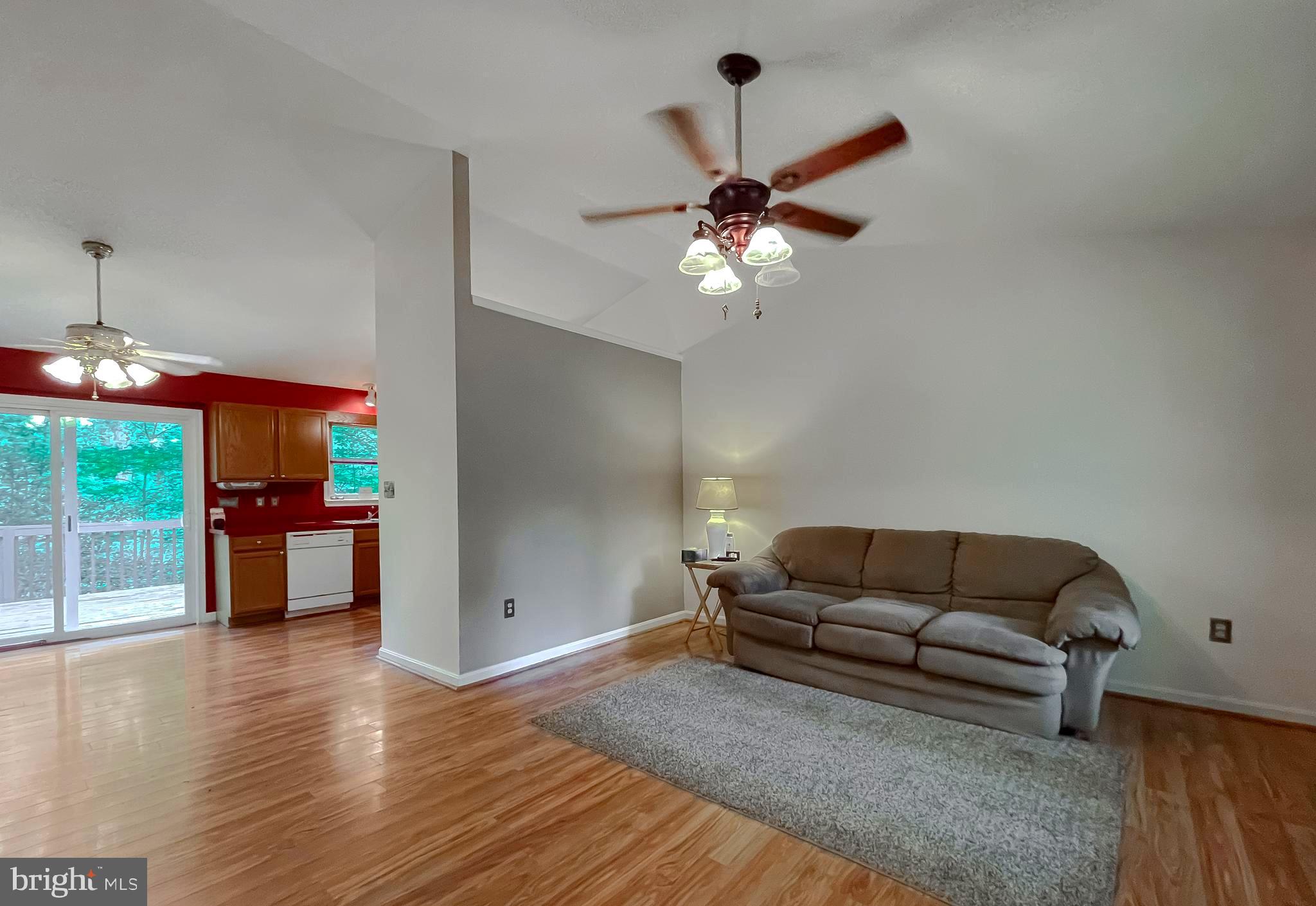 11517 Wrangler Road Lusby, MD 20657 - Photo 3 of 52 a living room with furniture and a chandelier