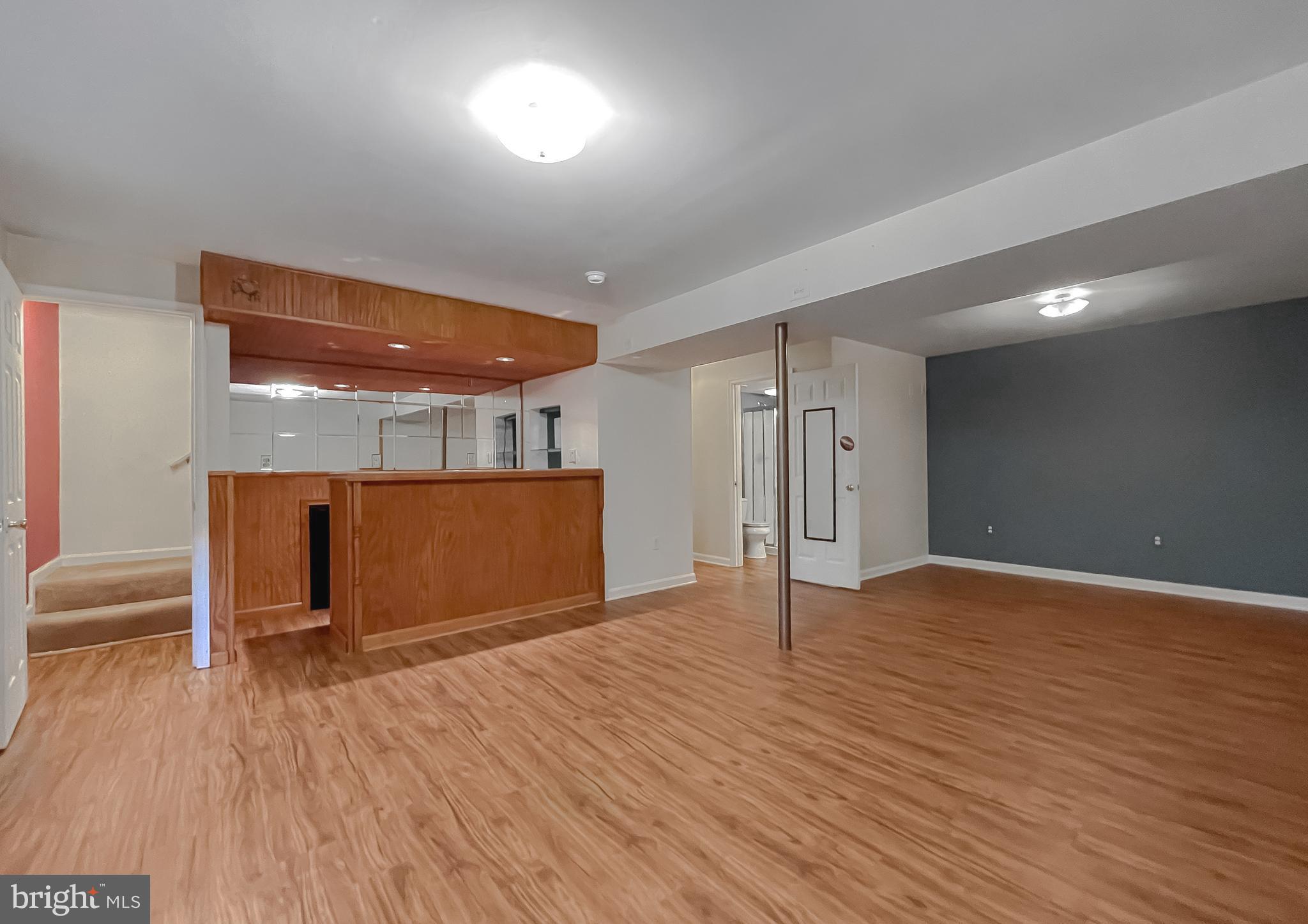 11517 Wrangler Road Lusby, MD 20657 - Photo 31 of 52 a view of an empty room with wooden floor