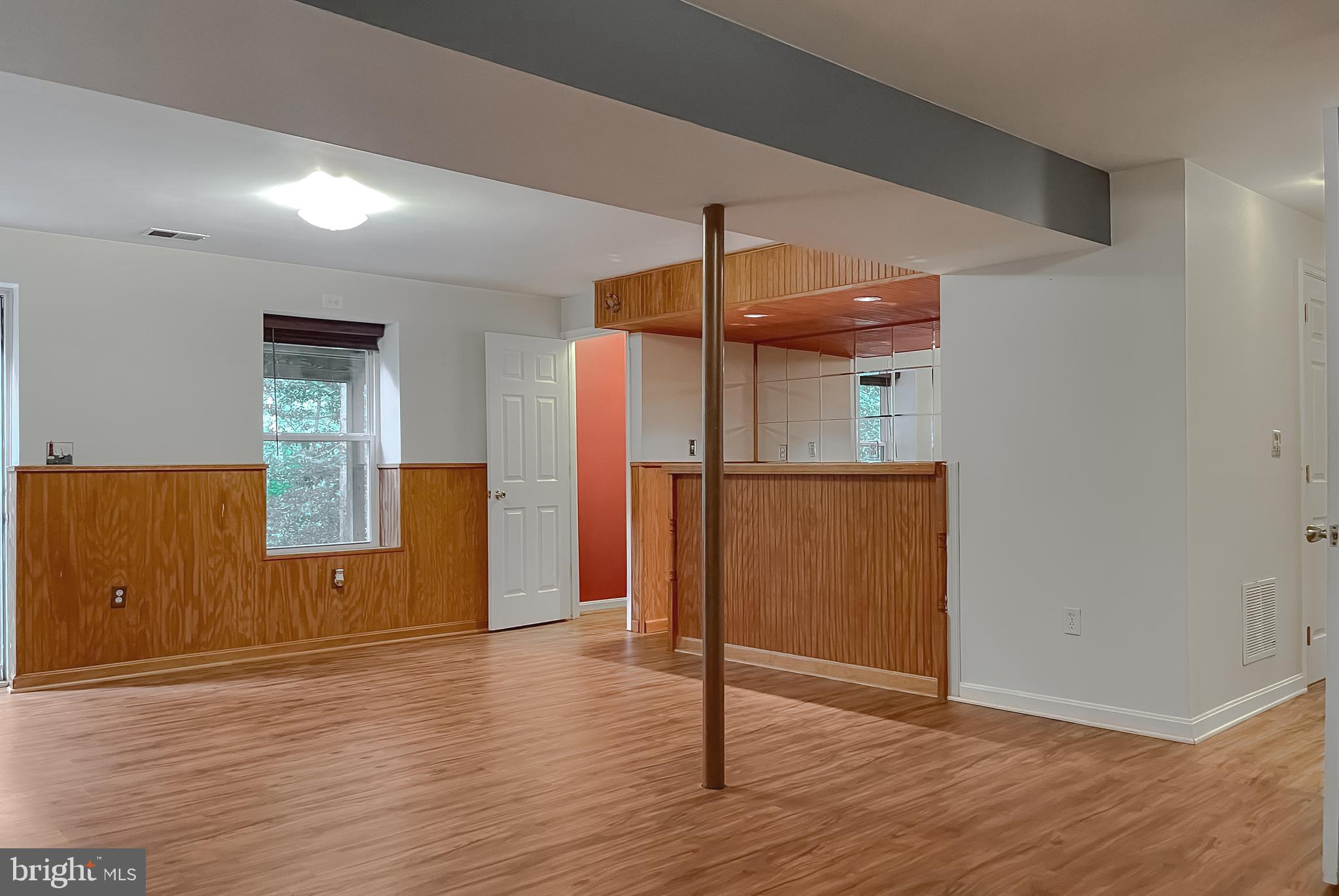11517 Wrangler Road Lusby, MD 20657 - Photo 33 of 52 a view of empty room with wooden floor