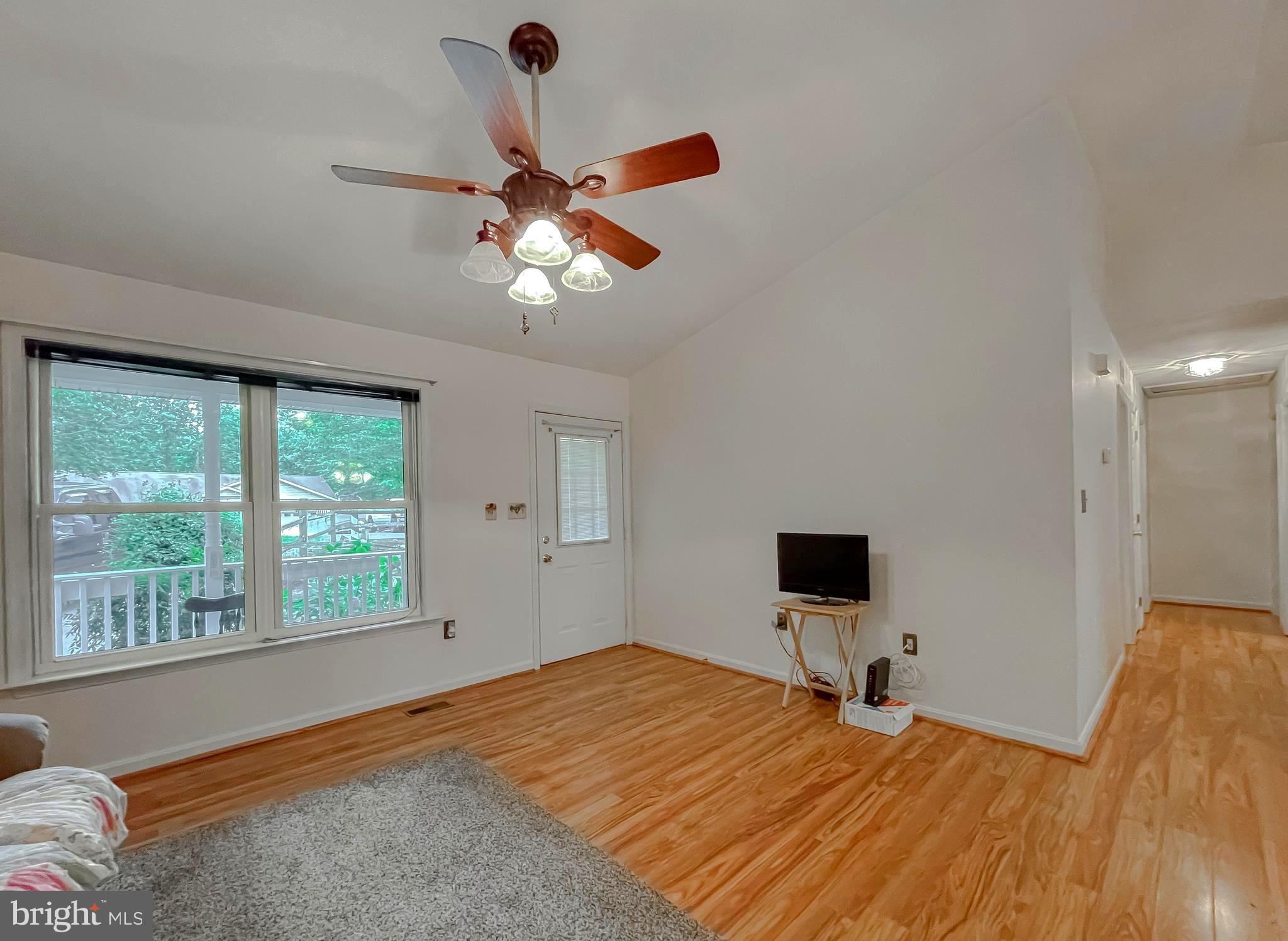 11517 Wrangler Road Lusby, MD 20657 - Photo 4 of 52 a bedroom with a bed and a window