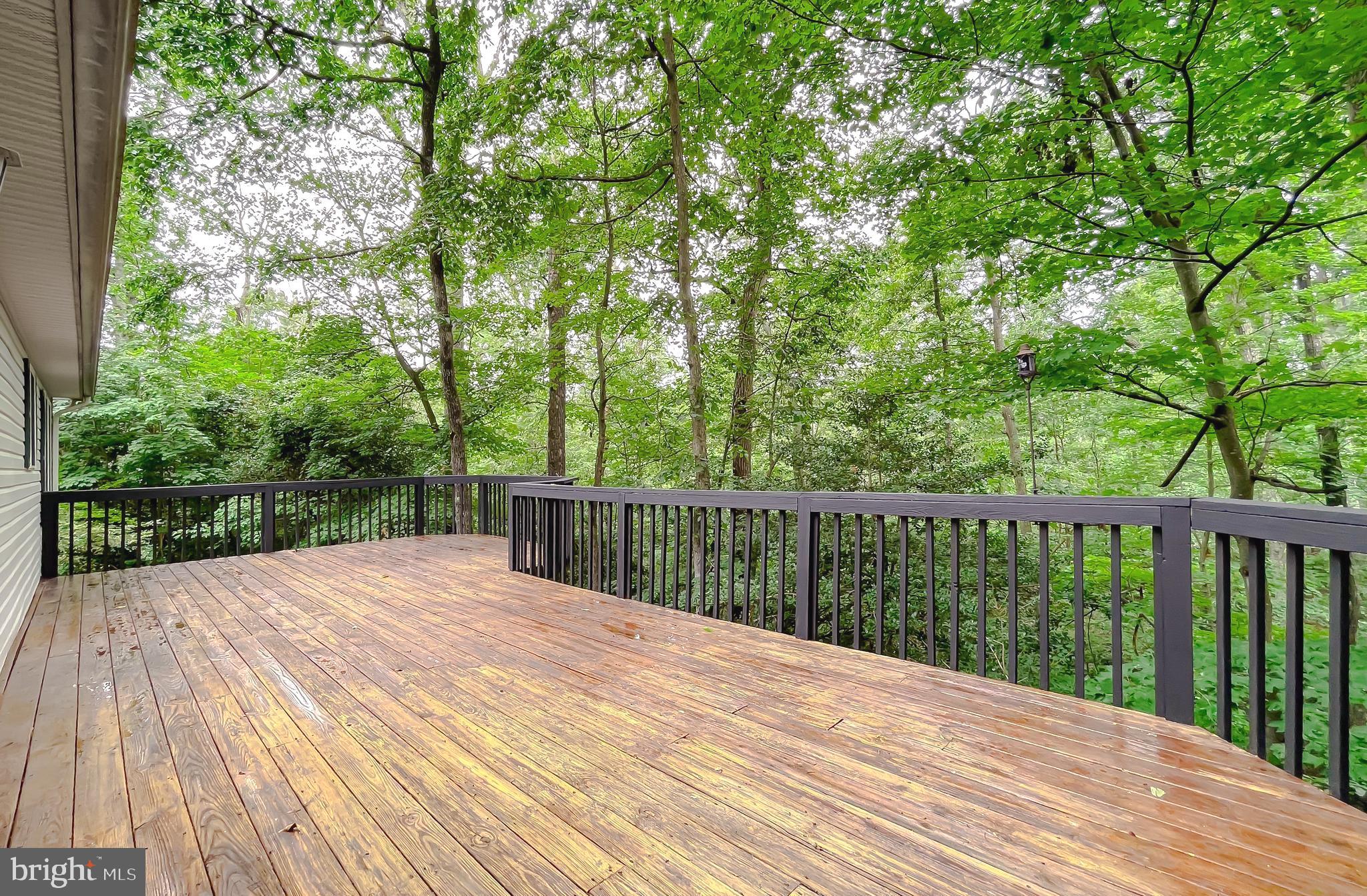 11517 Wrangler Road Lusby, MD 20657 - Photo 43 of 52 a view of balcony with wooden floor and fence