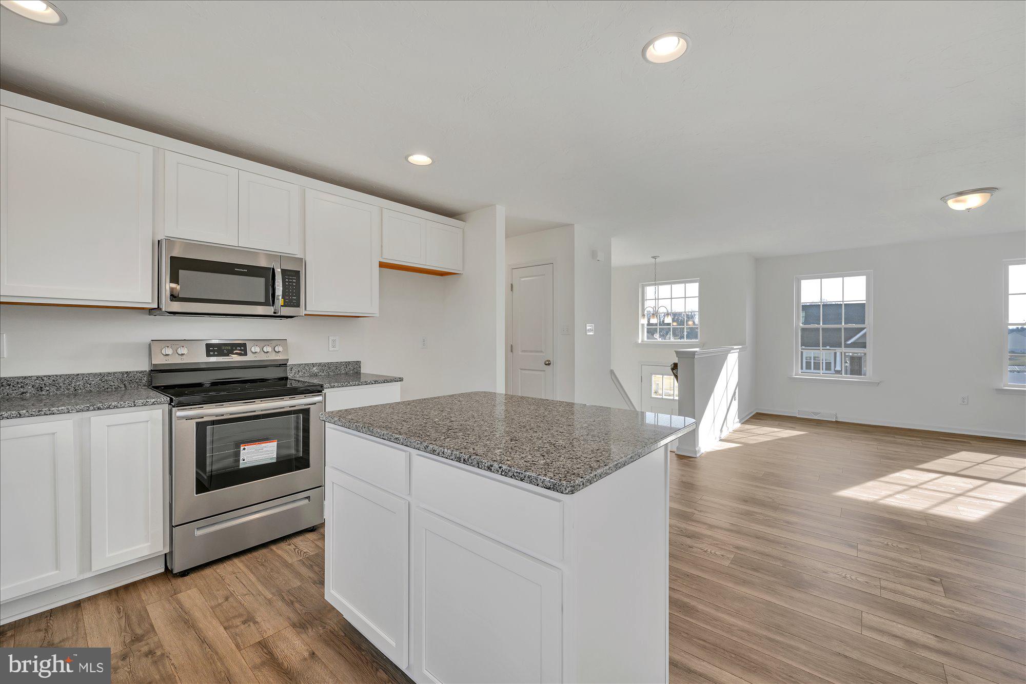 1280 Maple Lane, Unit 10 Hanover, PA 17331 - Photo 13 of 20 a kitchen with granite countertop a stove and a sink