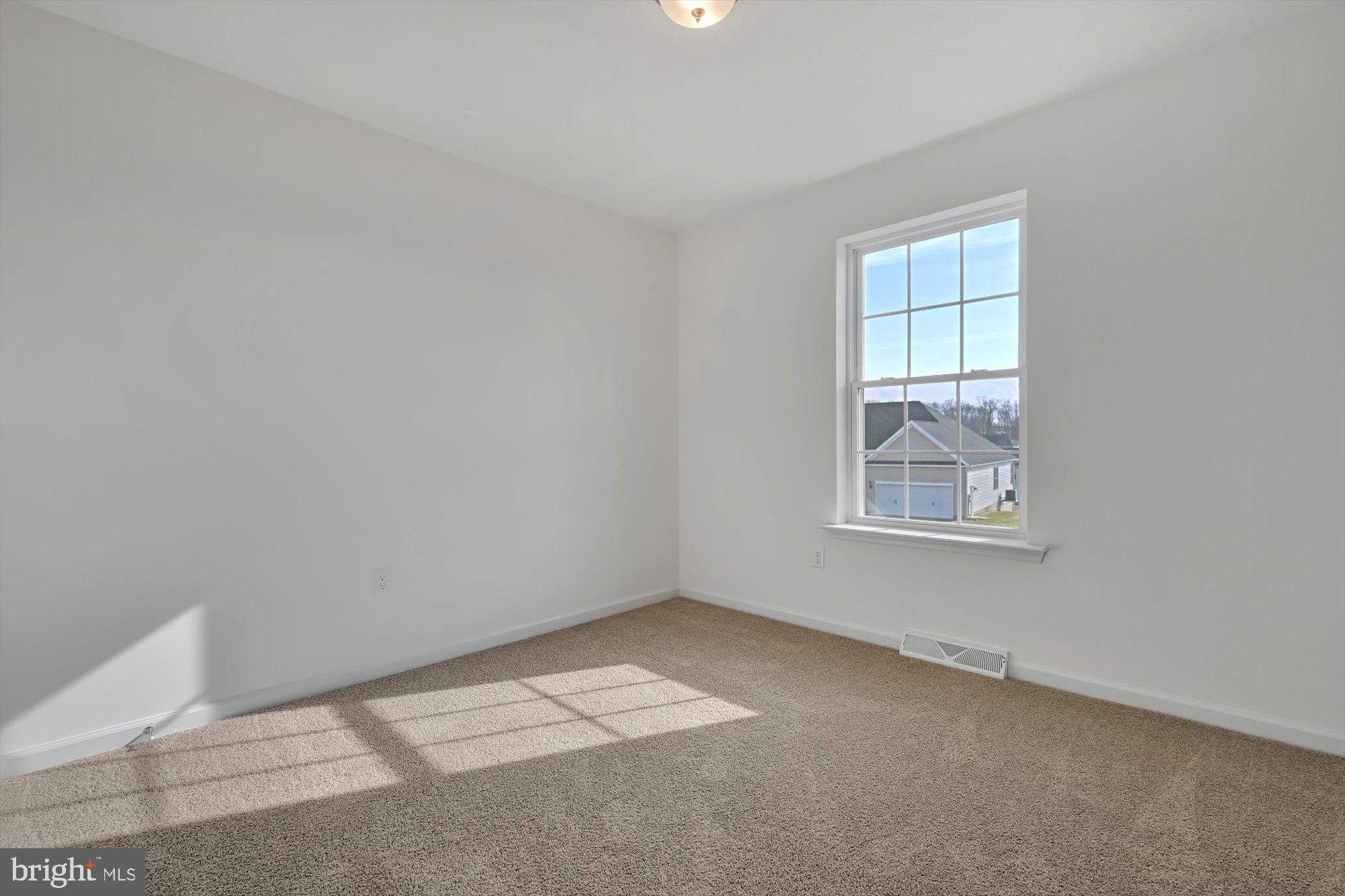1280 Maple Lane, Unit 10 Hanover, PA 17331 - Photo 18 of 20 an empty room with windows