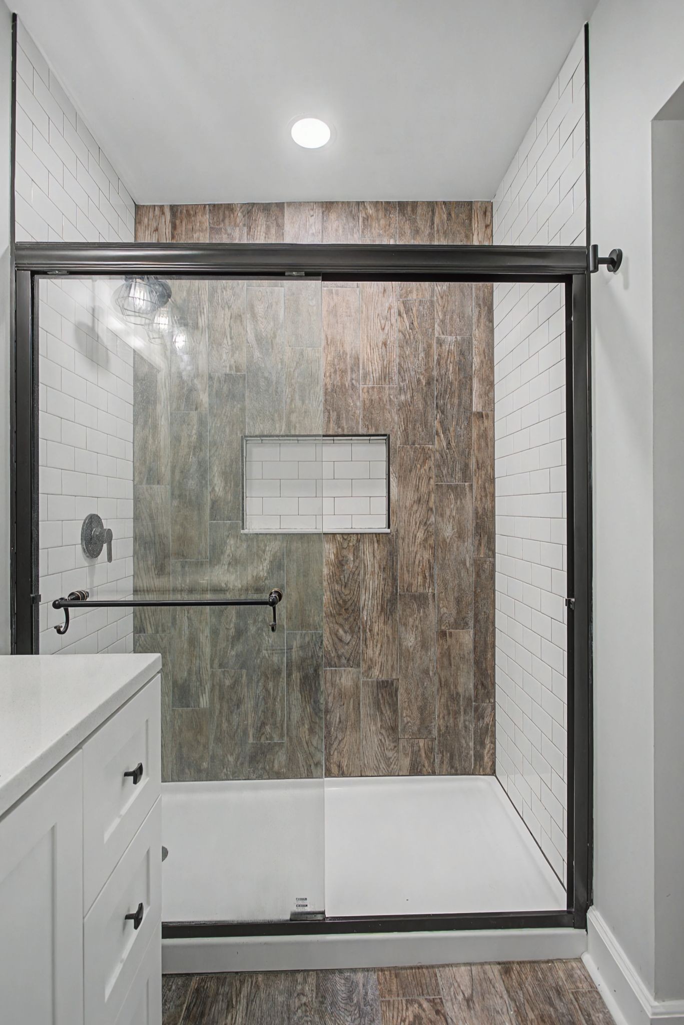 107 Cherry Street Centerville, TN 37033 - Photo 25 of 33 a bathroom with a shower and a sink a mirror