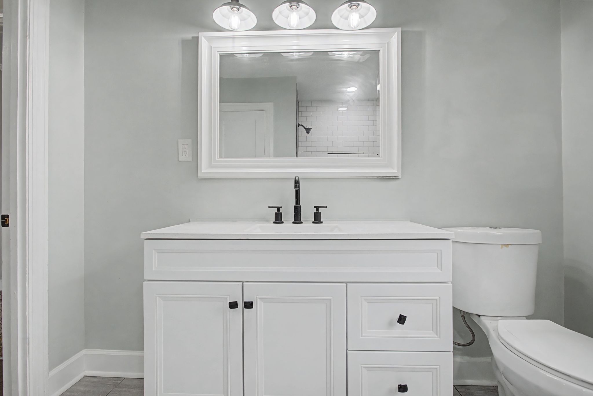 107 Cherry Street Centerville, TN 37033 - Photo 27 of 33 a bathroom with a sink a toilet and mirror