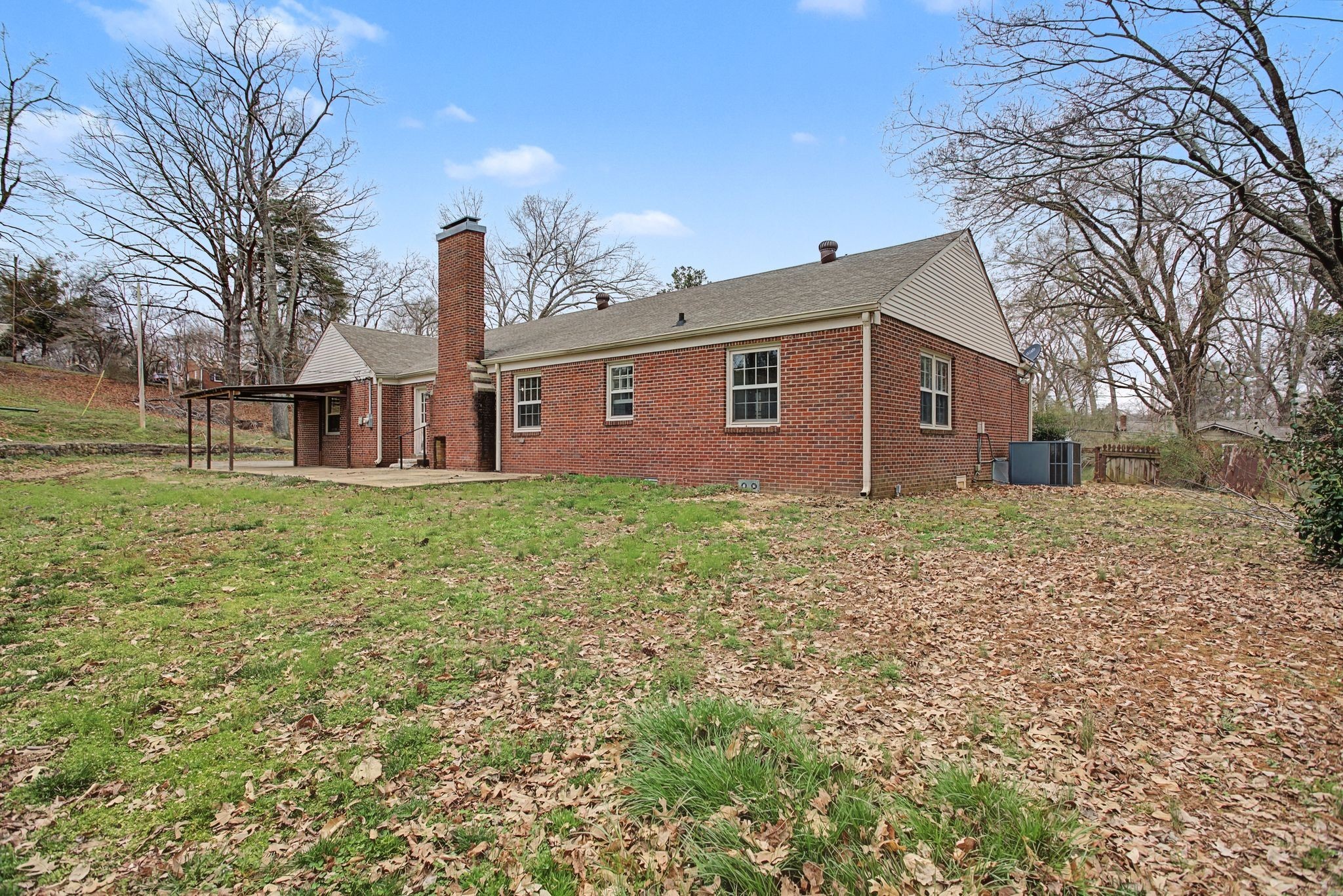 107 Cherry Street Centerville, TN 37033 - Photo 32 of 33 a front view of house with yard and trees around