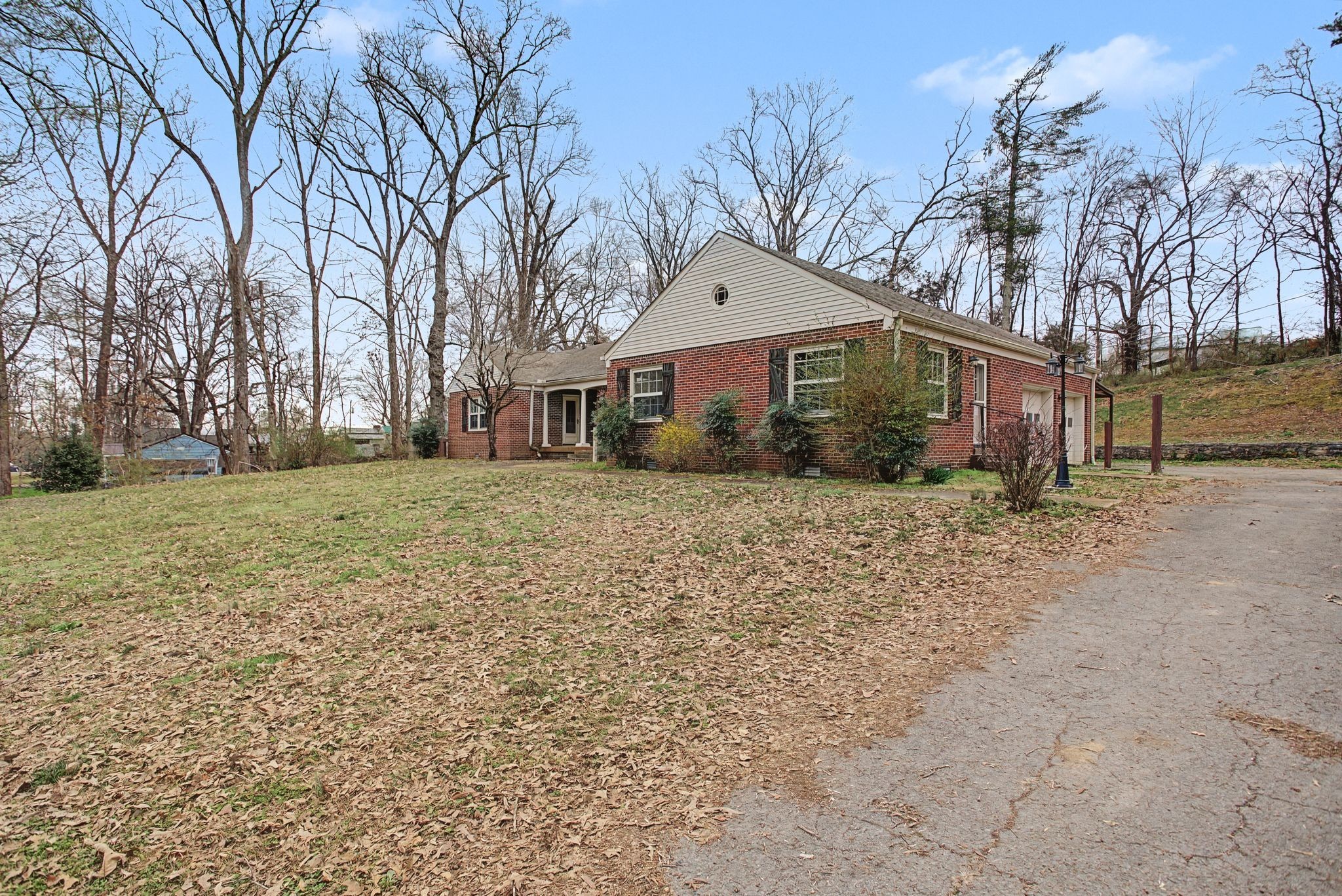 107 Cherry Street Centerville, TN 37033 - Photo 4 of 33 a view of a large white house with a yard