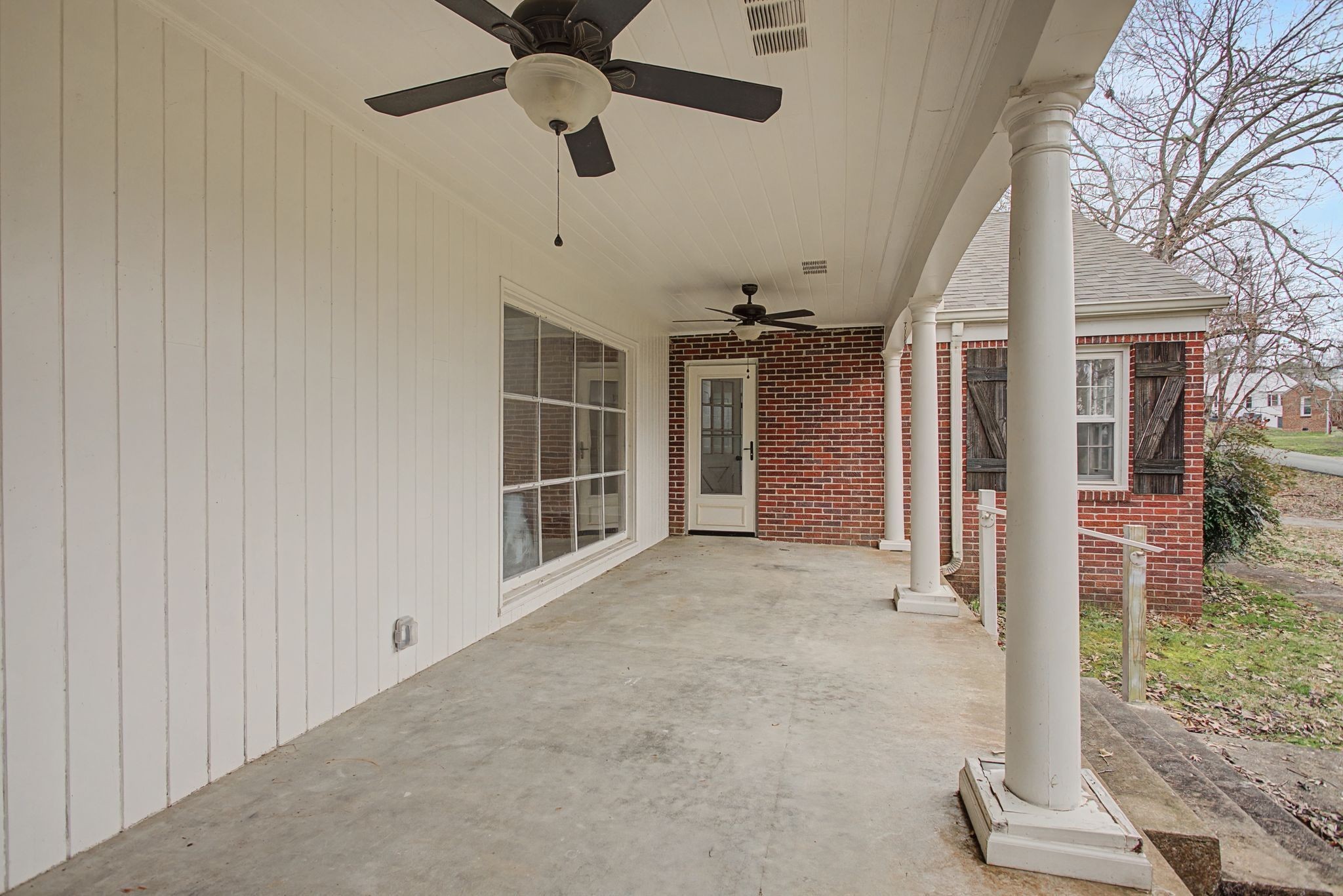 107 Cherry Street Centerville, TN 37033 - Photo 6 of 33 a view of empty room with wooden floor and fan