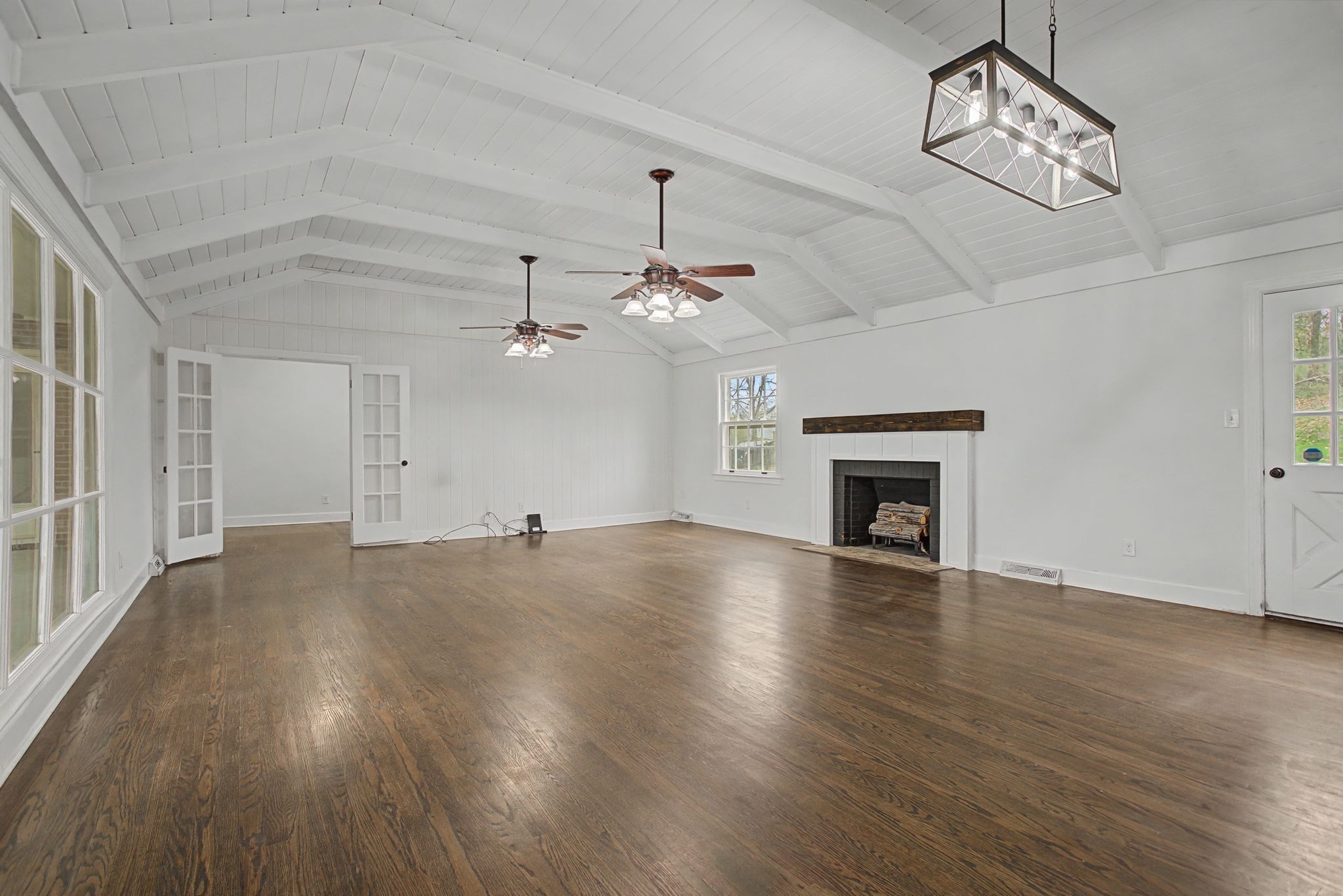 107 Cherry Street Centerville, TN 37033 - Photo 7 of 33 a view of an empty room with wooden floor fireplace and a window