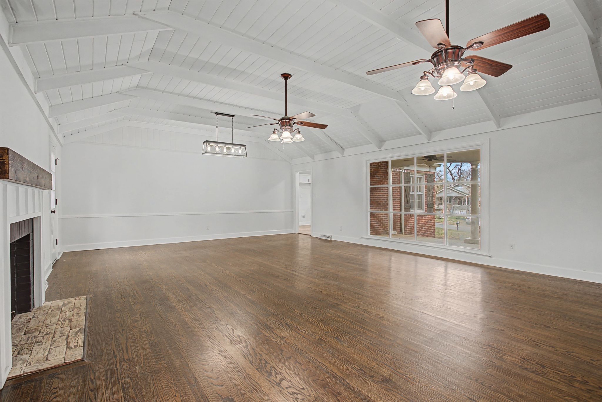107 Cherry Street Centerville, TN 37033 - Photo 10 of 33 a view of an empty room with wooden floor and a window