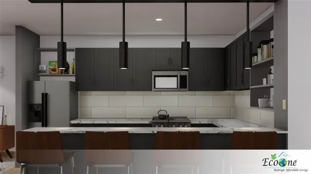 a kitchen with stainless steel appliances granite countertop a refrigerator and a stove