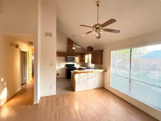 a kitchen with a stove a sink and a refrigerator