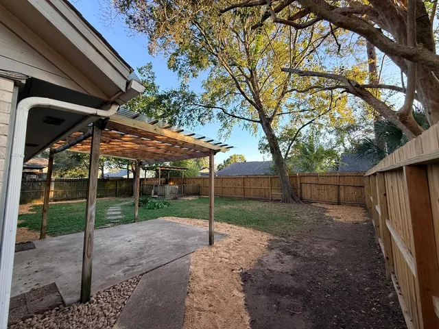 a backyard of a house with lots of green space
