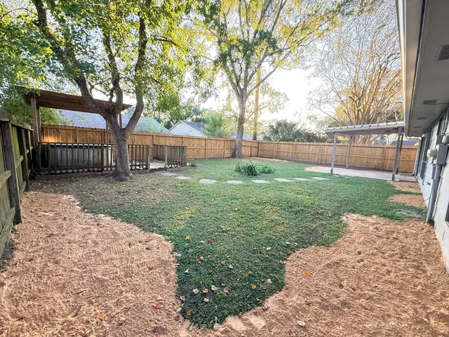 a view of outdoor space with swimming pool and trees