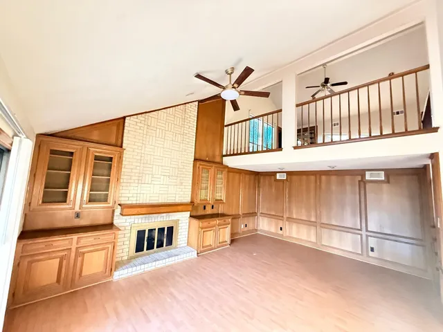 a view of a house with a ceiling fan