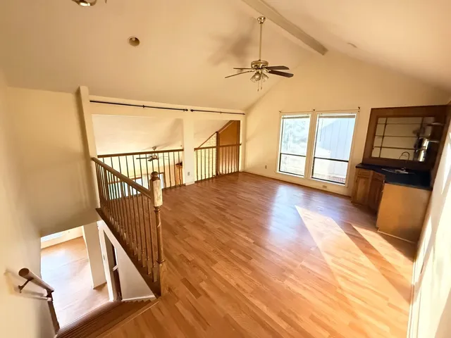 a view of an entryway with wooden floor