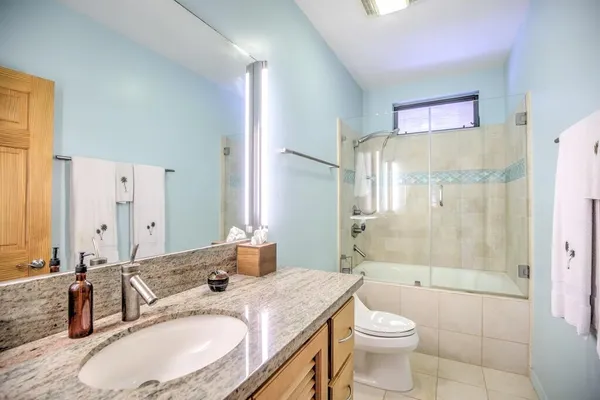 a view of a balcony with a small yard