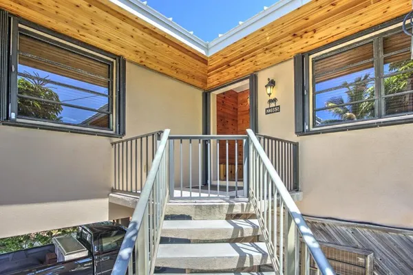 a view of a building with street view and a trees