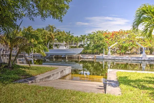 a view of yard with swimming pool and green space