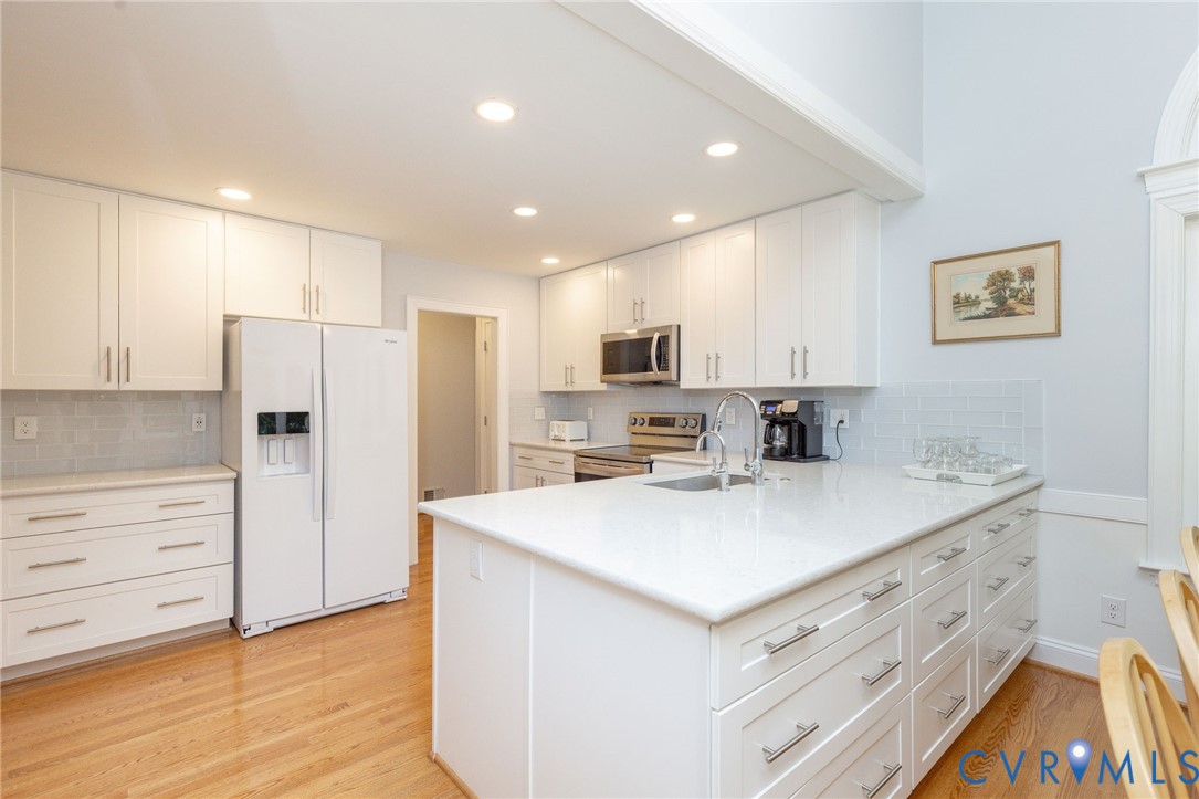 5724 Grove Forest Road Midlothian, VA 23112 - Photo 16 of 47 Kitchen featuring white cabinetry, light-colored c