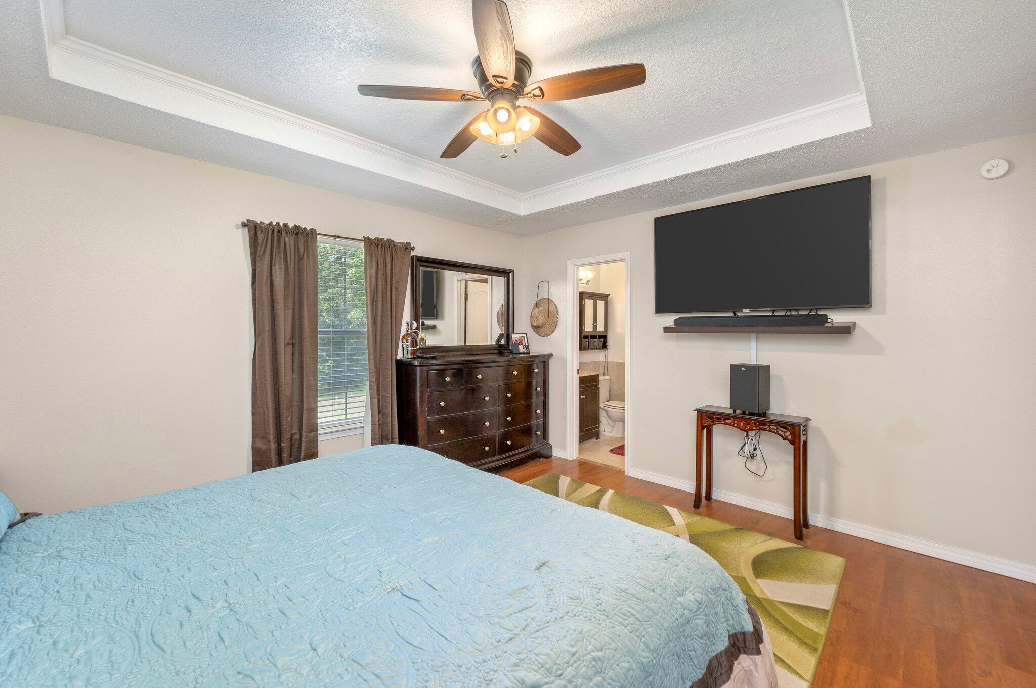 17 Flora Cove Crestview, FL 32539 - Photo 16 of 31 a bedroom with a bed and a flat screen tv