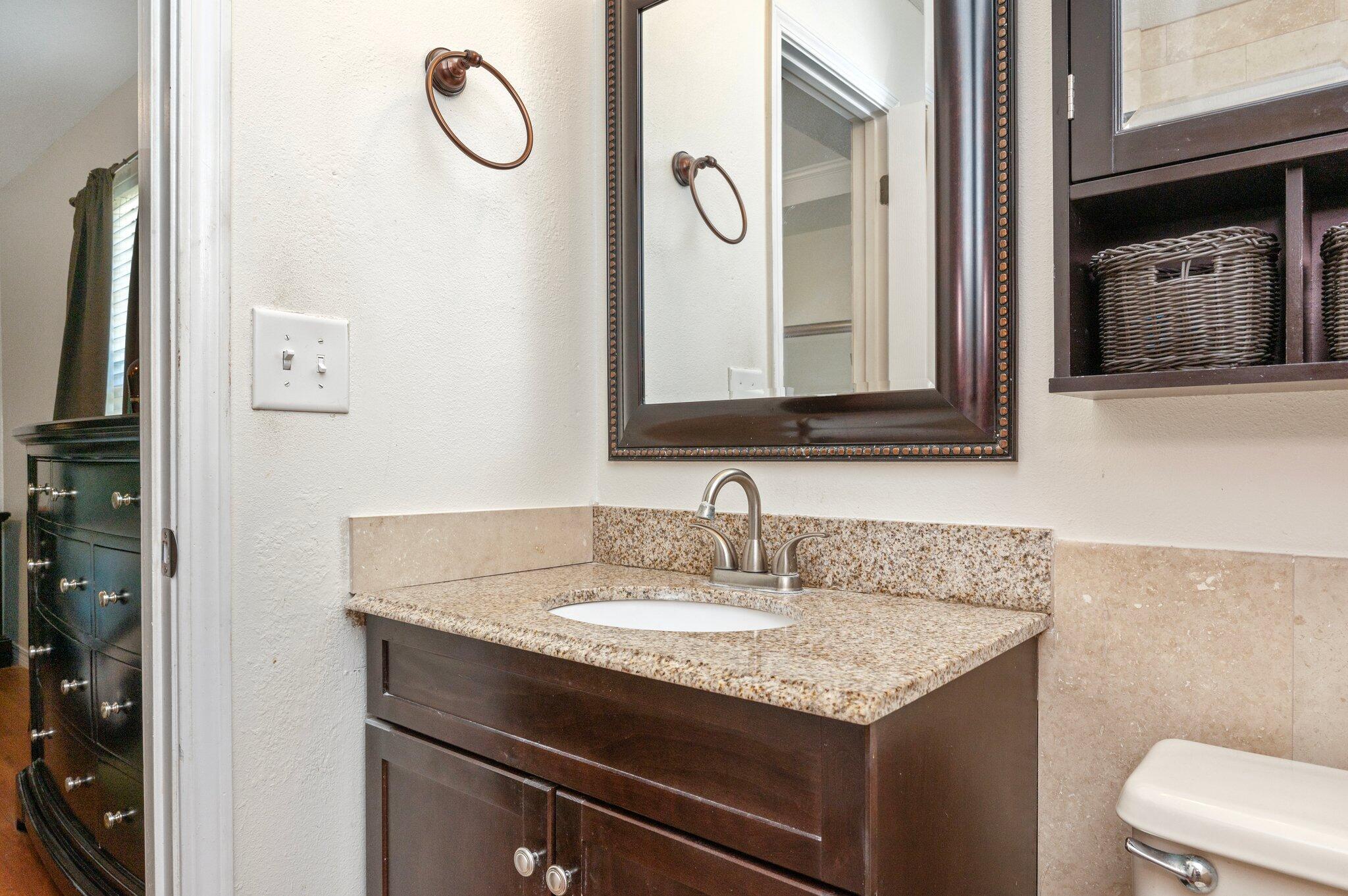 17 Flora Cove Crestview, FL 32539 - Photo 18 of 31 a bathroom with a granite countertop sink and a mirror