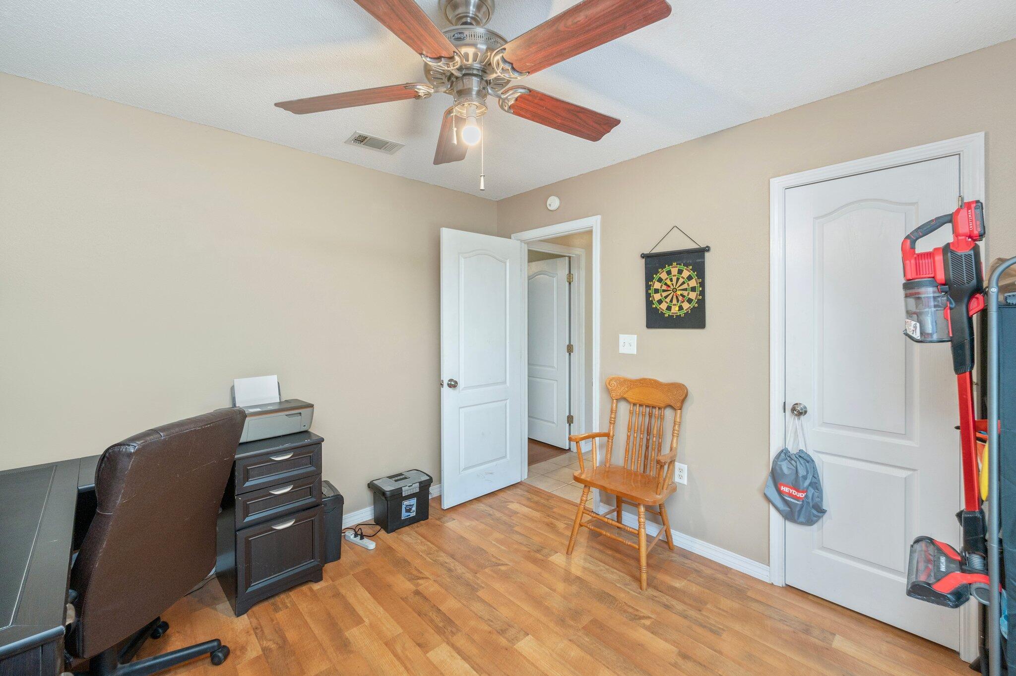 17 Flora Cove Crestview, FL 32539 - Photo 21 of 31 a bedroom with a bed and wooden floor