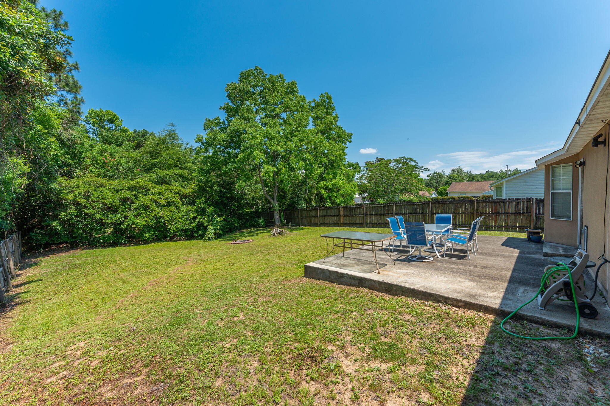 17 Flora Cove Crestview, FL 32539 - Photo 28 of 31 a view of a backyard with chairs potted plants and swimming pool