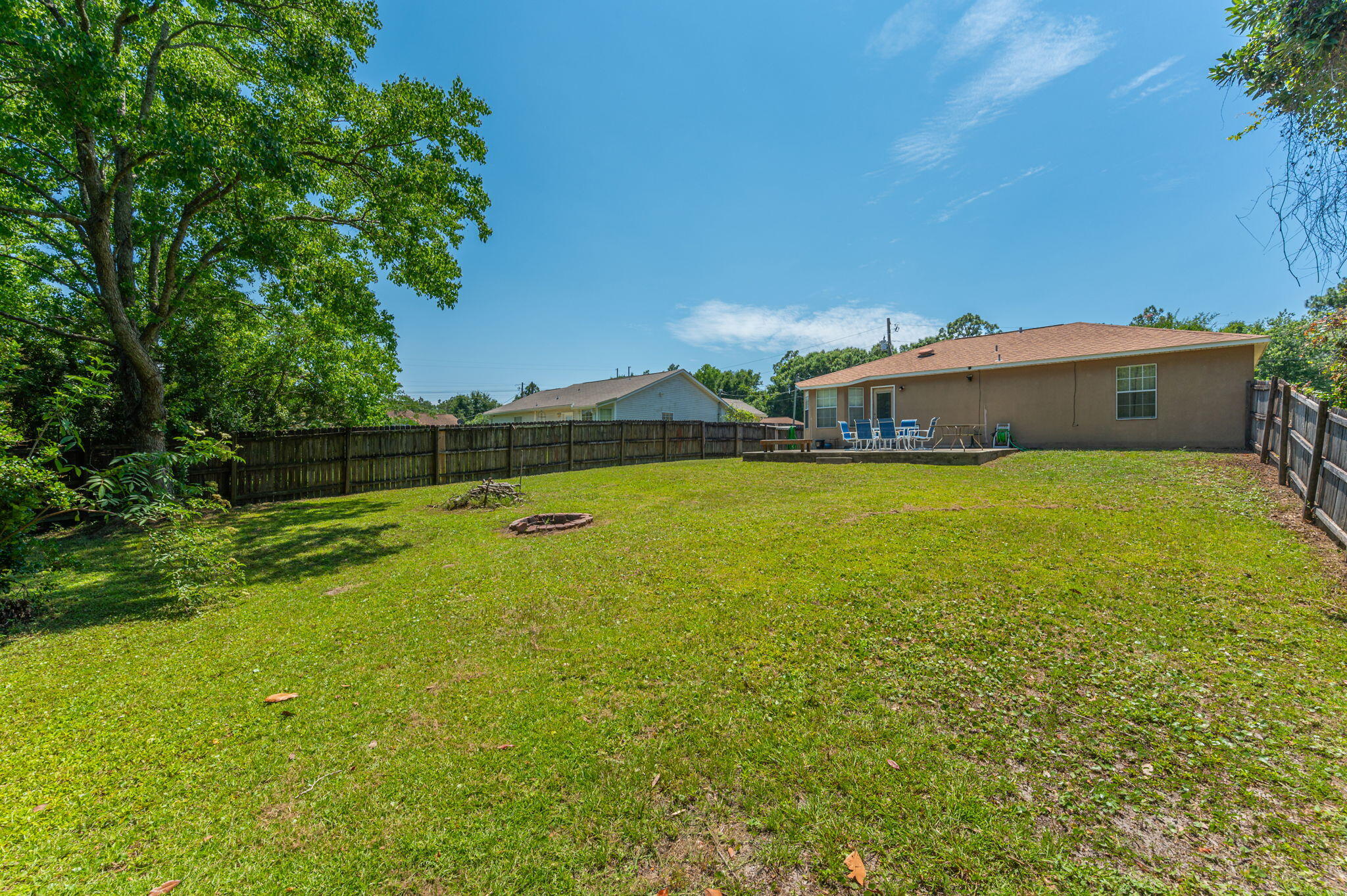 17 Flora Cove Crestview, FL 32539 - Photo 29 of 31 a view of a large pool with lawn chairs under an umbrella