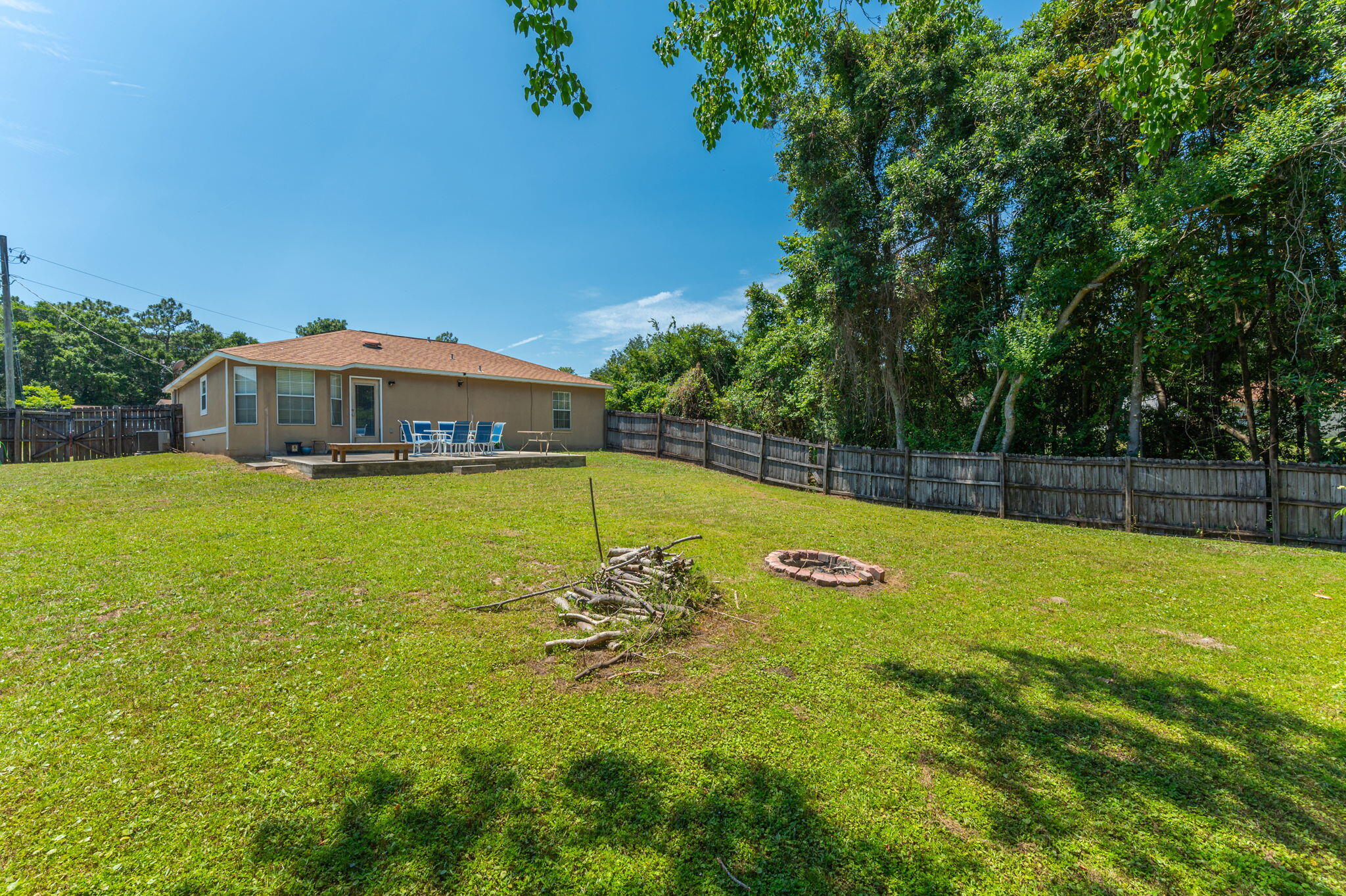 17 Flora Cove Crestview, FL 32539 - Photo 30 of 31 a view of a swimming pool with an outdoor space and seating area
