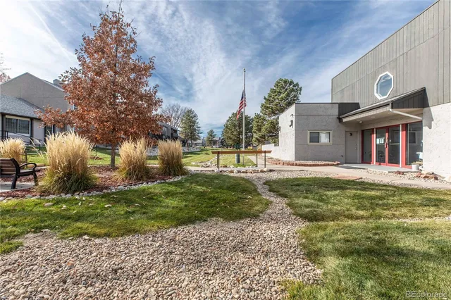 a view of a house with a yard and plants