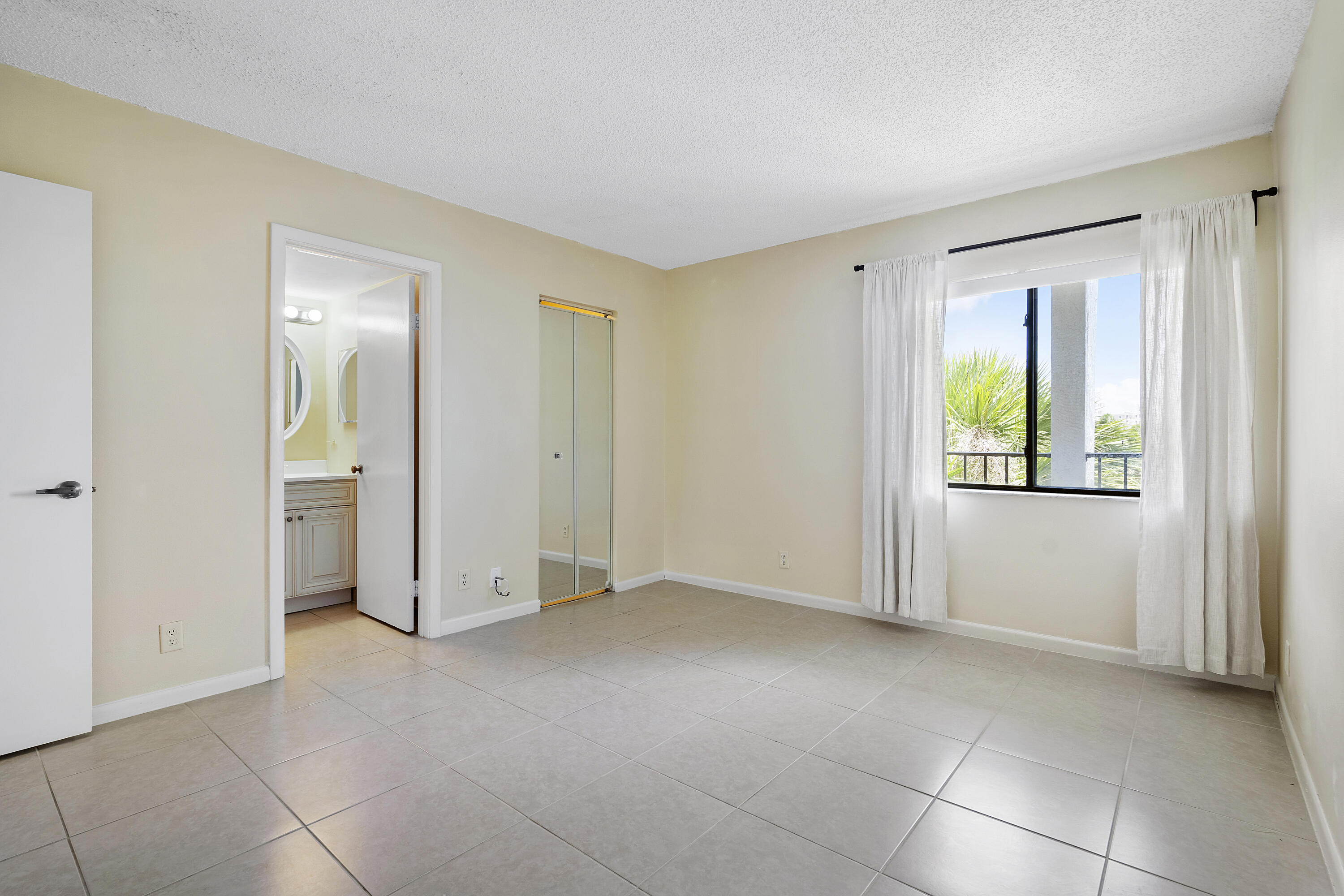 1605 Highway 1, Unit B404 Jupiter, FL 33477 - Photo 8 of 17 a view of an empty room with a window